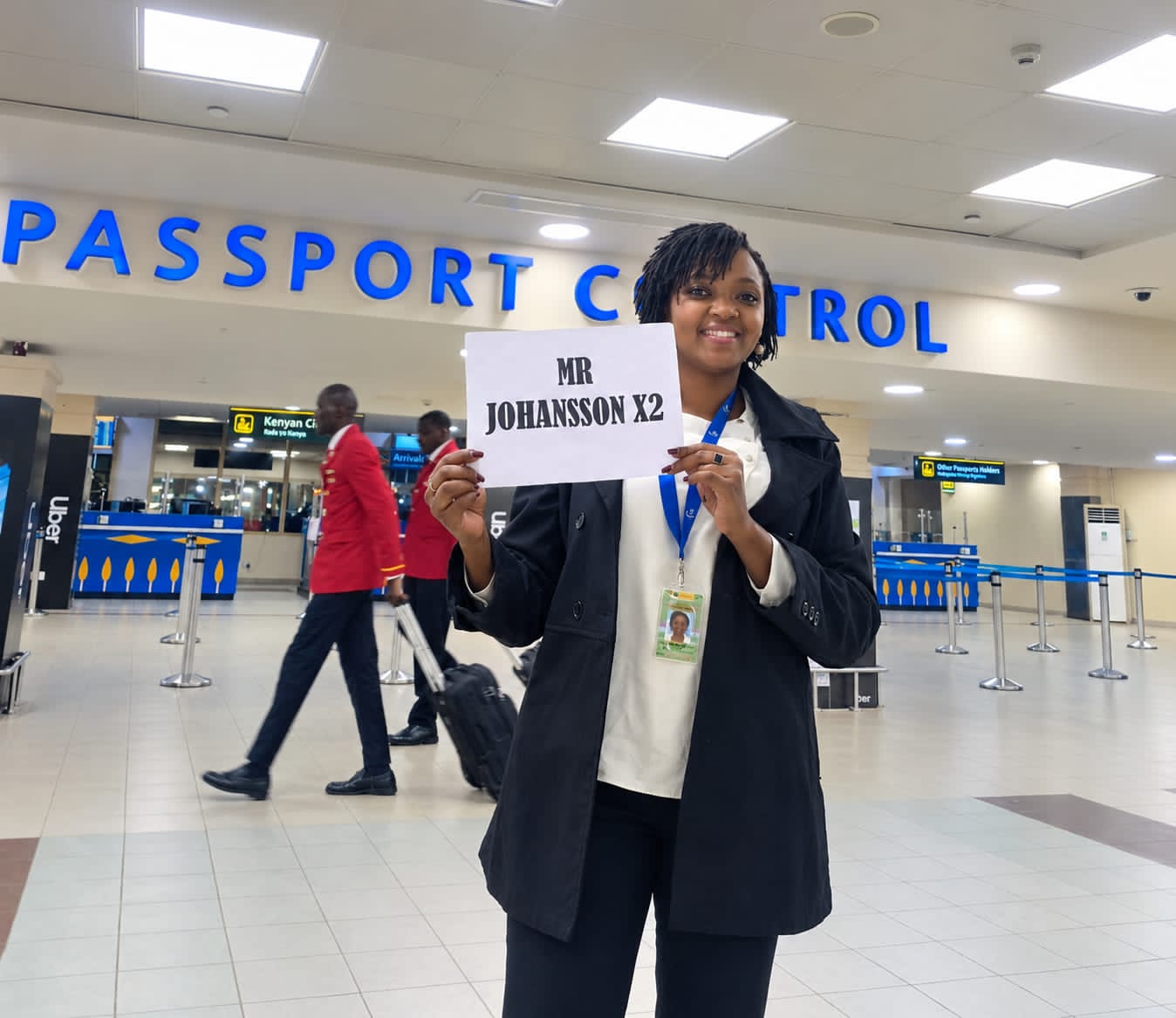 Goodlife Holidays driver meeting arriving passengers at JKIA with a name board
